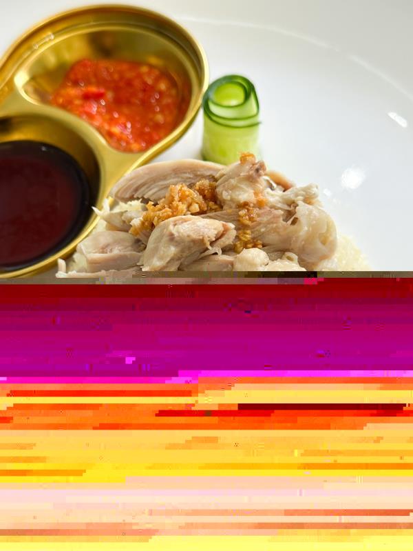 A close-up of the chicken rice, with its debo<em></em>ned chicken thigh crowning an upturned bowl of rice that is fragrant and fluffy grains. — Picture by Lee Khang Yi